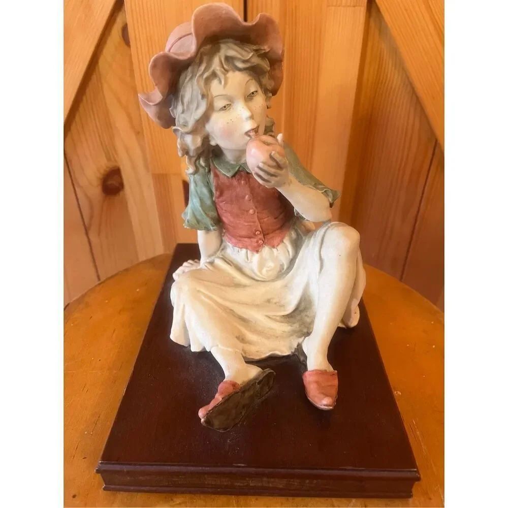Signed A.G. Armani/Capodimonte Green Eyed Girl Eating Apple Porcelain Sculpture